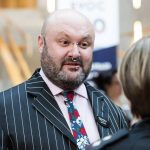 Photo of Ian Brooke in a suit